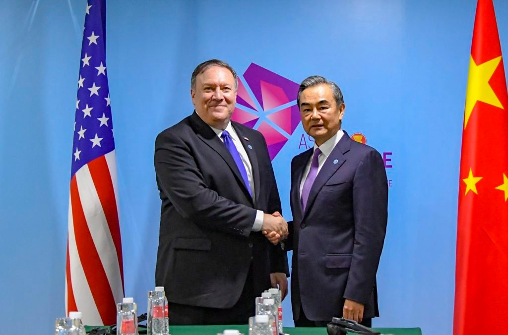 Secretary Michael R. Pompeo shakes hands with Chinese Foreign Minister Wang Yi